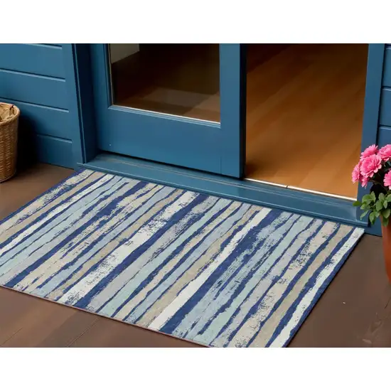 Navy Blue Beige And Ivory Striped Washable Indoor Outdoor Area Rug Photo 1