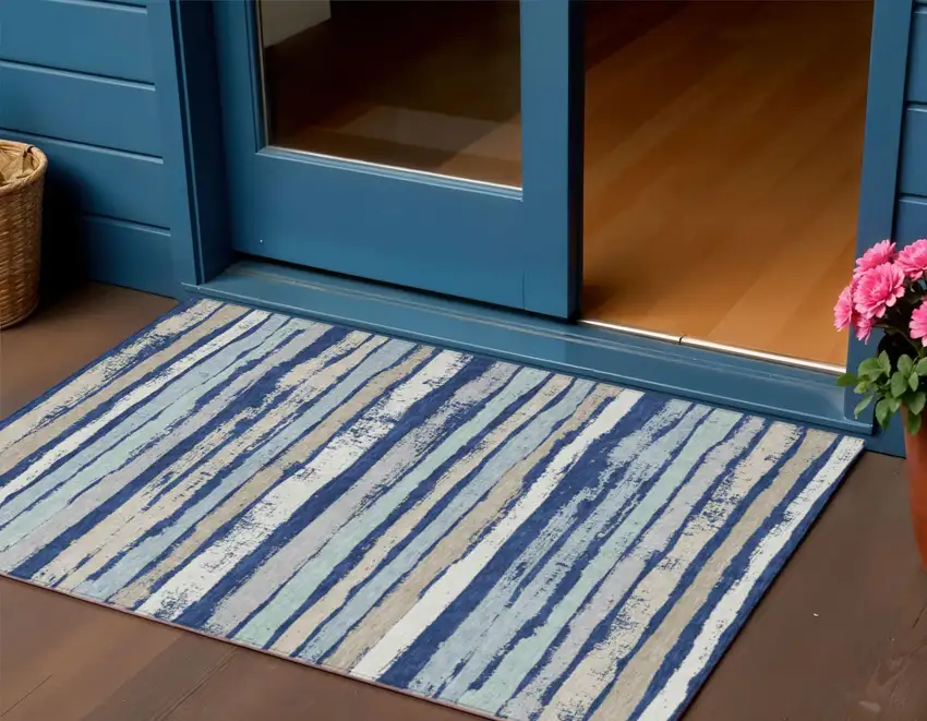 Navy Blue Beige And Ivory Striped Washable Indoor Outdoor Area Rug Photo 1