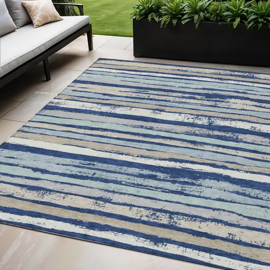 Navy Blue Beige And Ivory Striped Washable Indoor Outdoor Area Rug Photo 1