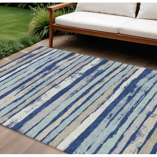 Navy Blue Beige And Ivory Striped Washable Indoor Outdoor Area Rug Photo 1