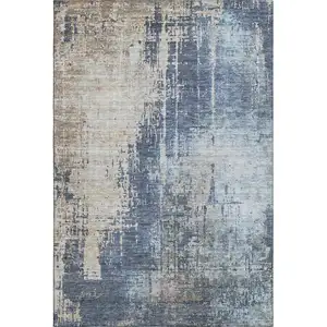 Photo of Navy Blue Beige And Taupe Abstract Washable Area Rug With UV Protection