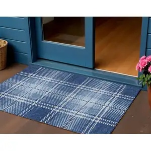Photo of Navy Blue Black And Ivory Plaid Washable Indoor Outdoor Area Rug