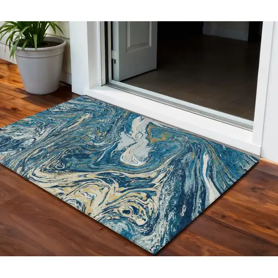 Navy Blue Gold And Ivory Abstract Washable Indoor Outdoor Area Rug Photo 1
