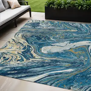 Photo of Navy Blue Gold And Ivory Abstract Washable Indoor Outdoor Area Rug