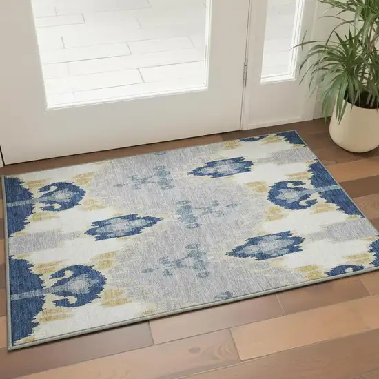 Navy Blue Gold And Ivory Ikat Washable Area Rug With UV Protection Photo 2