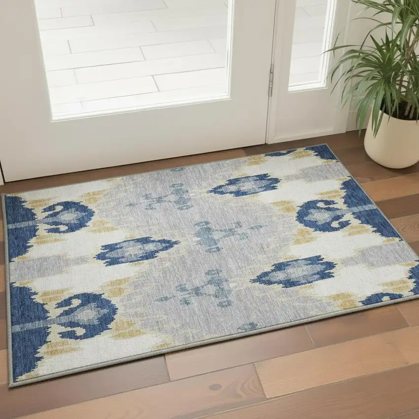 Navy Blue Gold And Ivory Ikat Washable Area Rug With UV Protection Photo 2
