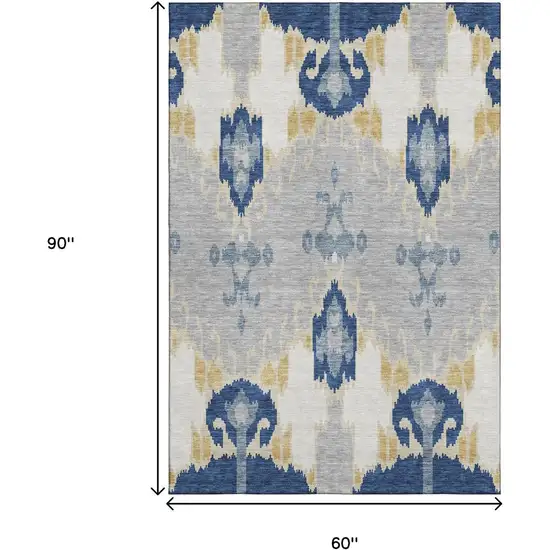 Navy Blue Gold And Ivory Ikat Washable Area Rug With UV Protection Photo 3