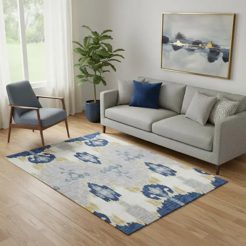 Navy Blue Gold And Ivory Ikat Washable Area Rug With UV Protection Photo 1