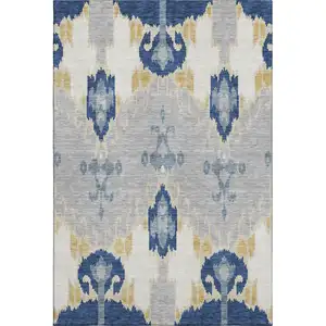 Photo of Navy Blue Gold And Ivory Ikat Washable Area Rug With UV Protection