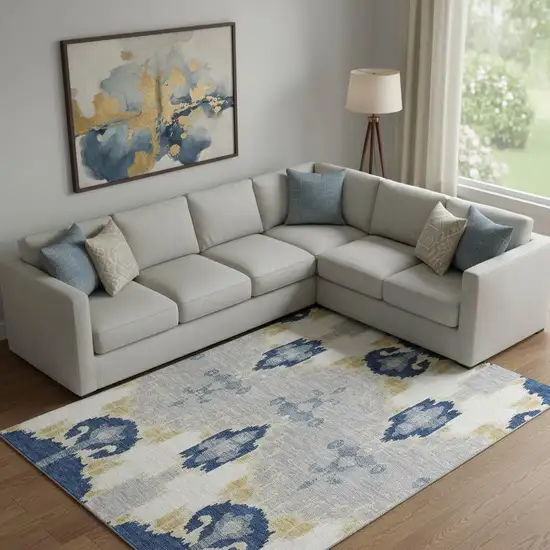 Navy Blue Gold And Ivory Ikat Washable Area Rug With UV Protection Photo 1