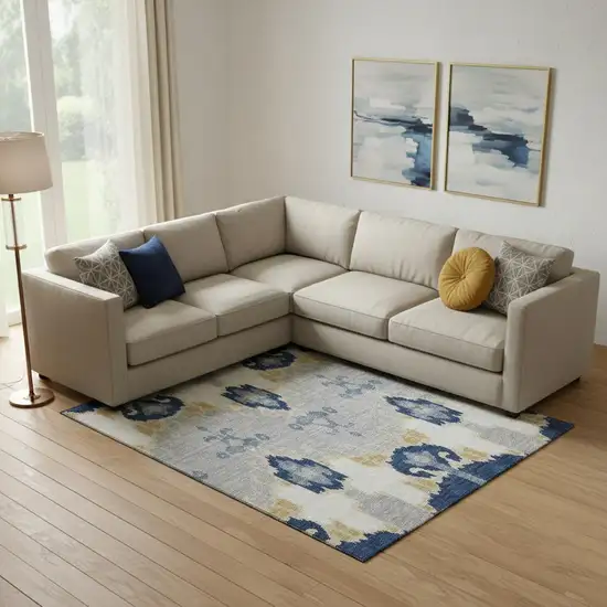 Navy Blue Gold And Ivory Ikat Washable Area Rug With UV Protection Photo 1