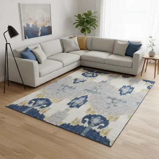 Navy Blue Gold And Ivory Ikat Washable Area Rug With UV Protection Photo 2