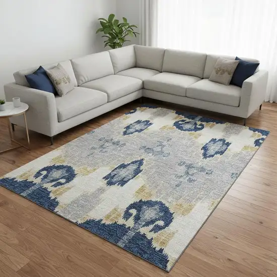 Navy Blue Gold And Ivory Ikat Washable Area Rug With UV Protection Photo 2