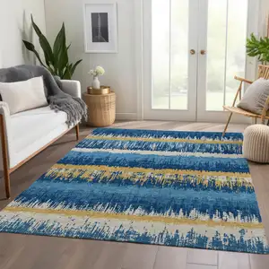 Photo of Navy Blue Gold And Ivory Striped Washable Area Rug With UV Protection