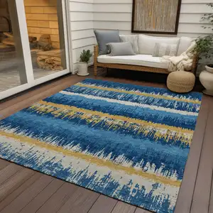 Photo of Navy Blue Gold And Ivory Striped Washable Indoor Outdoor Area Rug