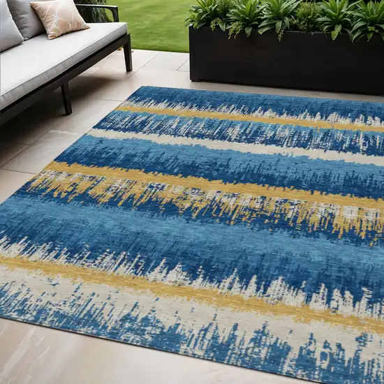 Navy Blue Gold And Ivory Striped Washable Indoor Outdoor Area Rug Photo 1