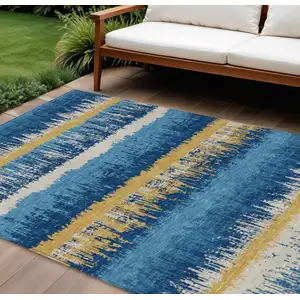 Photo of Navy Blue Gold And Ivory Striped Washable Indoor Outdoor Area Rug