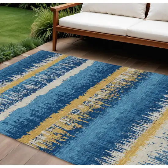 Navy Blue Gold And Ivory Striped Washable Indoor Outdoor Area Rug Photo 1