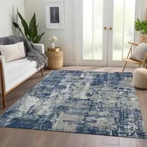 Photo of Navy Blue Gray And Ivory Abstract Washable Area Rug With UV Protection