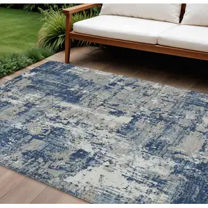 Photo of Navy Blue Gray And Ivory Abstract Washable Indoor Outdoor Area Rug