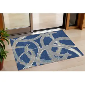 Photo of Navy Blue Gray And Ivory Abstract Washable Indoor Outdoor Area Rug