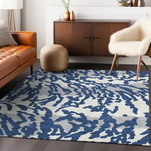 Photo of Navy Blue Gray And Ivory Animal Print Washable Indoor Outdoor Area Rug
