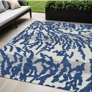 Photo of Navy Blue Gray And Ivory Animal Print Washable Indoor Outdoor Area Rug