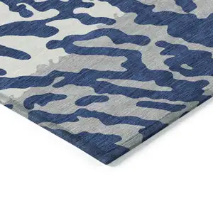 Photo of Navy Blue Gray And Ivory Animal Print Washable Indoor Outdoor Area Rug