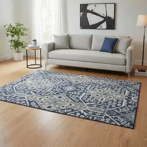 Photo of Navy Blue Gray And Ivory Floral Washable Area Rug With UV Protection