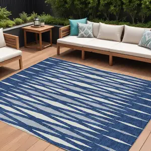 Photo of Navy Blue Gray And Ivory Geometric Washable Indoor Outdoor Area Rug
