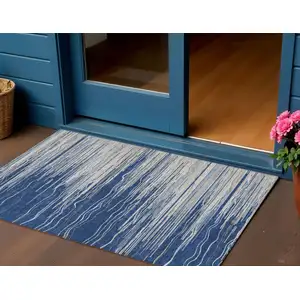 Photo of Navy Blue Gray And Ivory Striped Washable Indoor Outdoor Area Rug