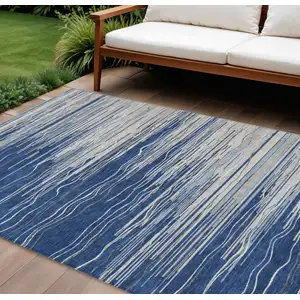 Photo of Navy Blue Gray And Ivory Striped Washable Indoor Outdoor Area Rug