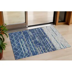 Photo of Navy Blue Gray And Ivory Striped Washable Indoor Outdoor Area Rug