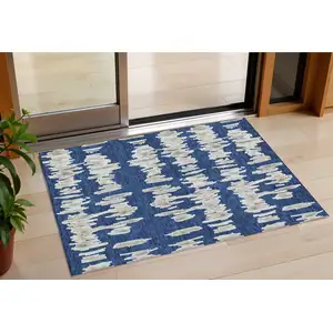 Photo of Navy Blue Gray And Ivory Striped Washable Indoor Outdoor Area Rug