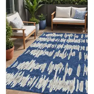 Photo of Navy Blue Gray And Ivory Striped Washable Indoor Outdoor Area Rug