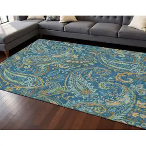 Photo of Navy Blue Green And Gold Paisley Washable Area Rug With UV Protection