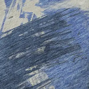 Photo of Navy Blue Green And Ivory Abstract Washable Area Rug With UV Protection