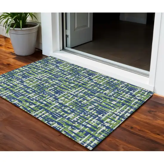 Navy Blue Green And Ivory Abstract Washable Indoor Outdoor Area Rug Photo 1