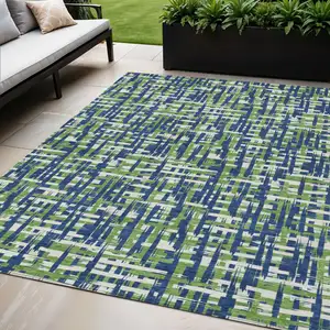 Photo of Navy Blue Green And Ivory Abstract Washable Indoor Outdoor Area Rug
