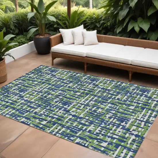 Navy Blue Green And Ivory Abstract Washable Indoor Outdoor Area Rug Photo 1
