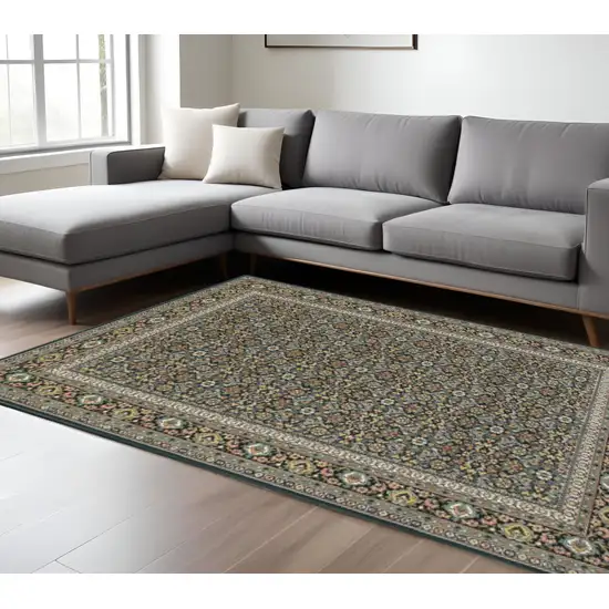 6' X 9' Navy Blue Green Red Ivory And Yellow Oriental Power Loom Stain Resistant Area Rug Photo 1