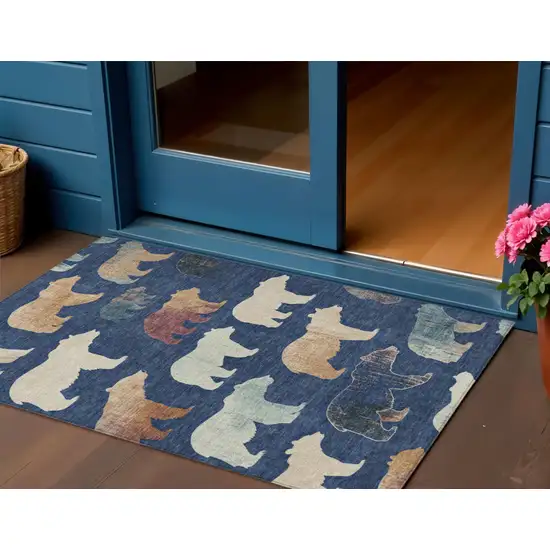 Navy Blue Ivory And Beige Animal Print Washable Indoor Outdoor Area Rug Photo 1