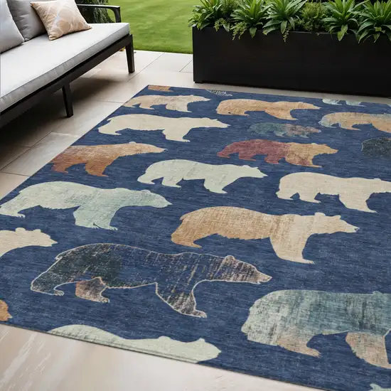 Navy Blue Ivory And Beige Animal Print Washable Indoor Outdoor Area Rug Photo 1