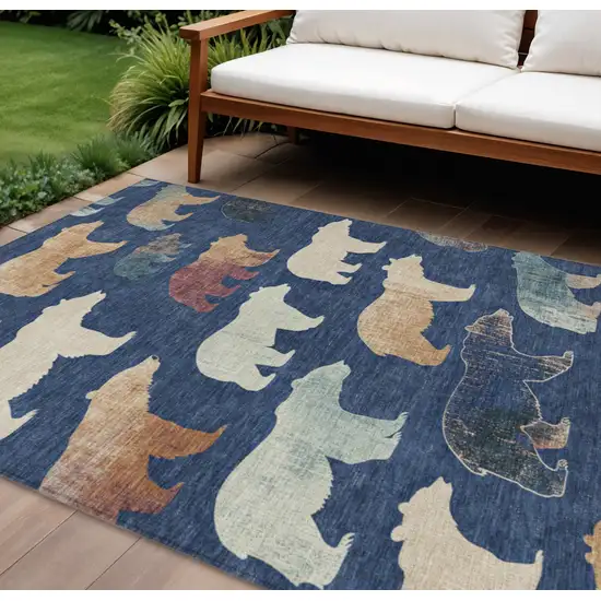Navy Blue Ivory And Beige Animal Print Washable Indoor Outdoor Area Rug Photo 1
