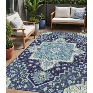 Photo of Navy Blue Ivory And Black Oriental Washable Indoor Outdoor Area Rug