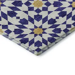 Photo of Navy Blue Ivory And Gold Geometric Washable Area Rug With UV Protection