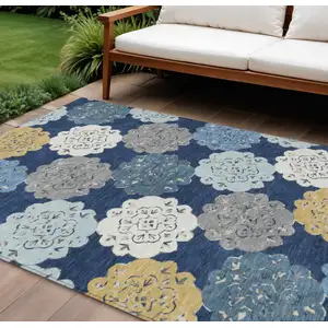 Photo of Navy Blue Ivory And Gold Quatrefoil Washable Indoor Outdoor Area Rug