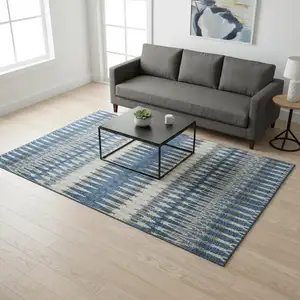 Photo of Navy Blue Ivory And Gray Southwestern Washable Area Rug With UV Protection