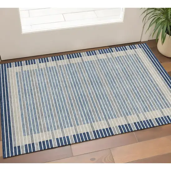 Navy Blue Ivory And Gray Striped Washable Area Rug With UV Protection Photo 1