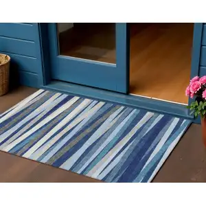Photo of Navy Blue Ivory And Gray Striped Washable Indoor Outdoor Area Rug